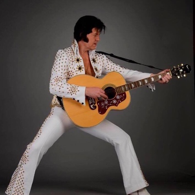 Adam Carter as Elvis